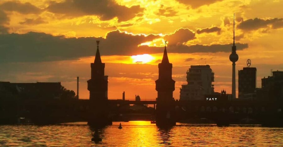 The Oberbaumbrücke at dusk with the television tower behind it